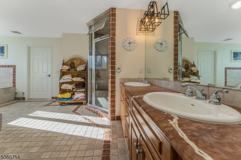 93 Bissell Road Lebanon, NJ 08833 - Photo 18 of 32 a bathroom with a sink a mirror and a shower