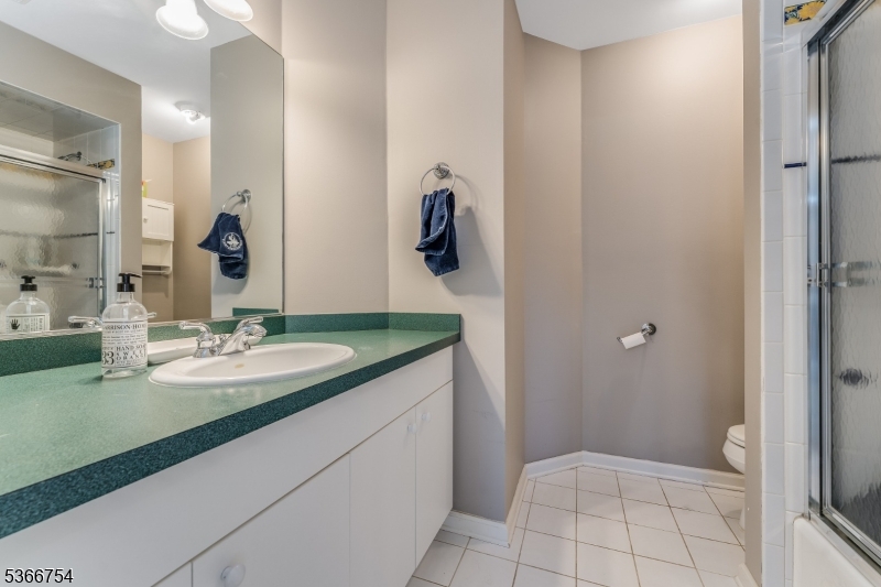 93 Bissell Road Lebanon, NJ 08833 - Photo 27 of 32 a bathroom with a sink and mirror