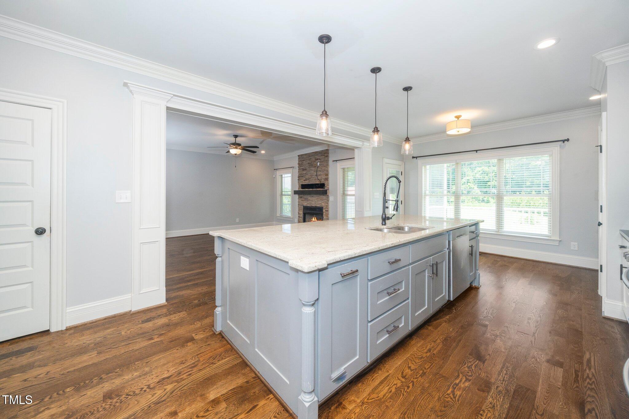6737 Dwight Rowland Road Willow Spring, NC 27592 - Photo 20 of 50 a bathroom with a granite countertop sink and a large mirror