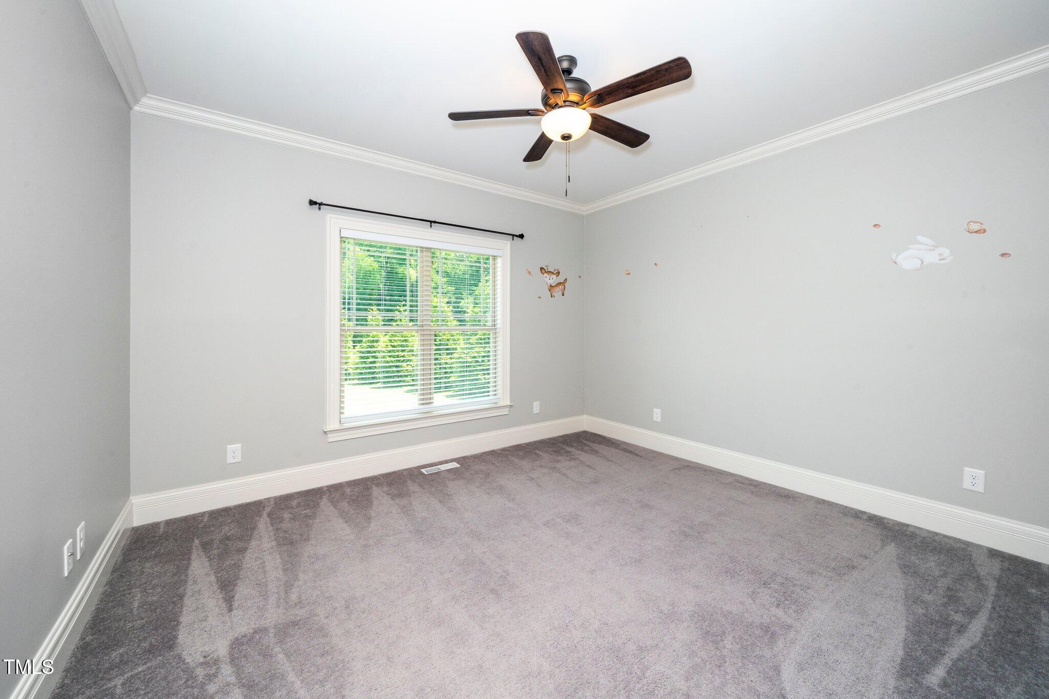 6737 Dwight Rowland Road Willow Spring, NC 27592 - Photo 23 of 50 an empty room with a window