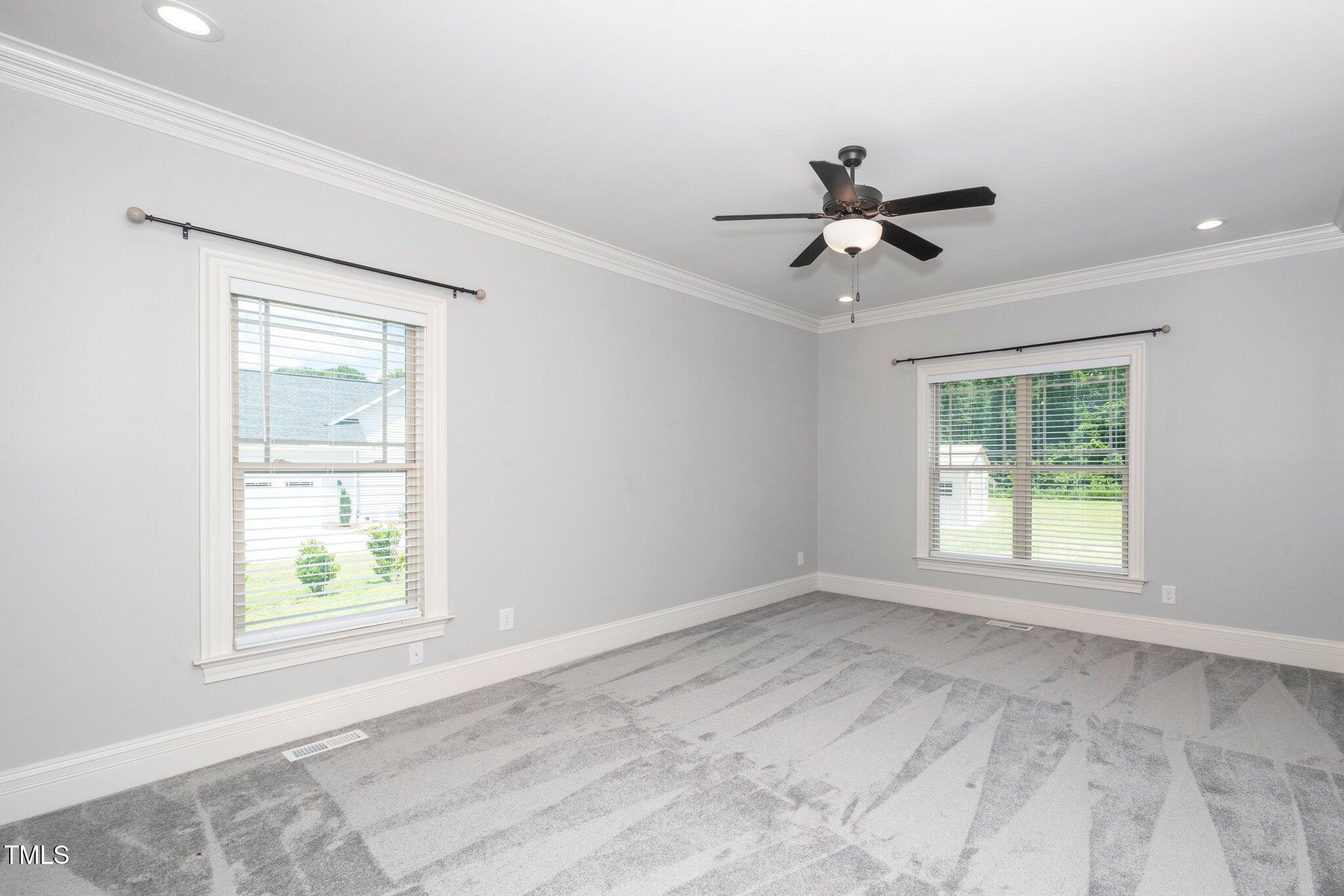 6737 Dwight Rowland Road Willow Spring, NC 27592 - Photo 27 of 50 a view of an empty room with a window