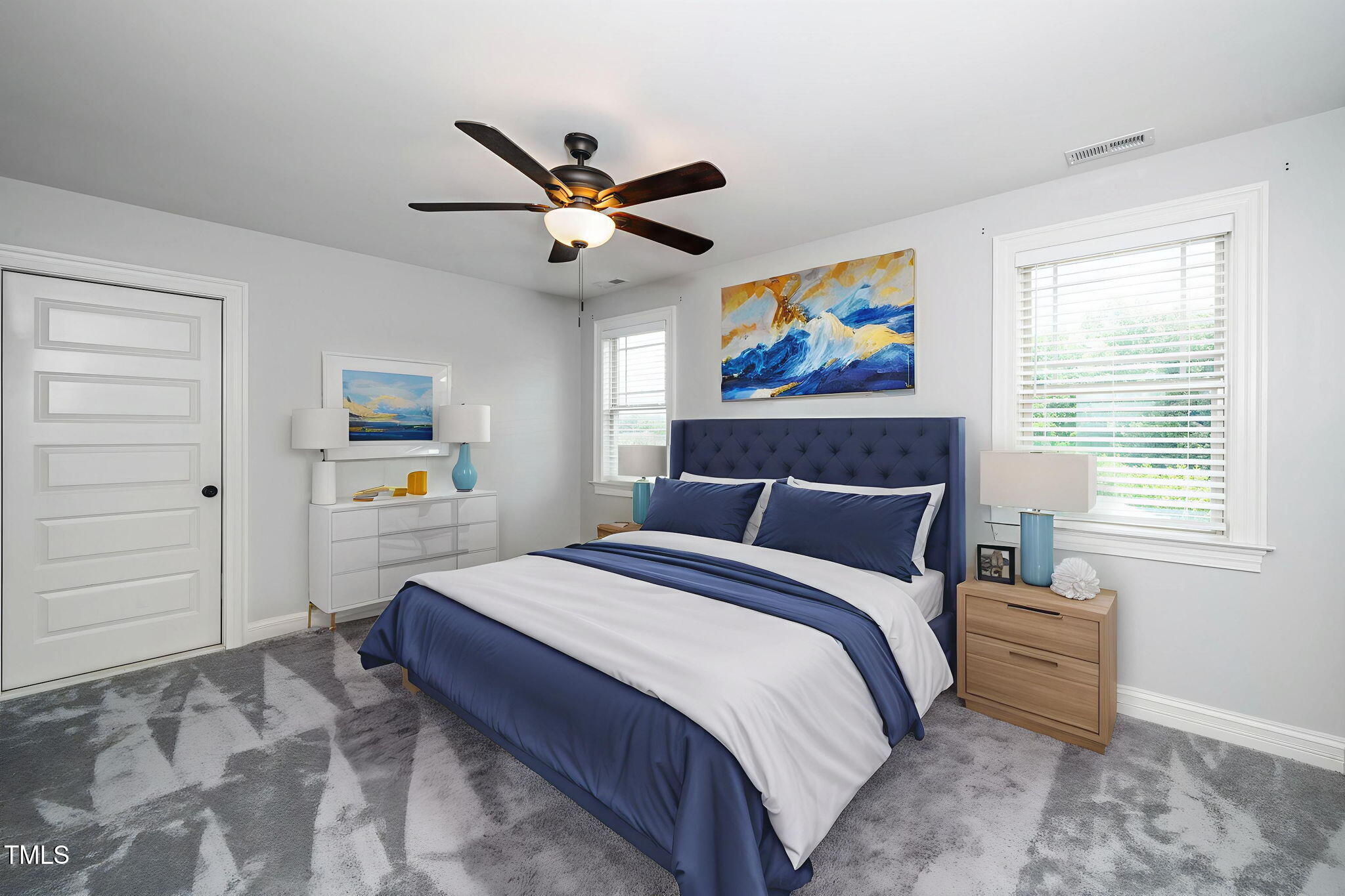 6737 Dwight Rowland Road Willow Spring, NC 27592 - Photo 31 of 50 a spacious bedroom with a bed and a painting on the wall