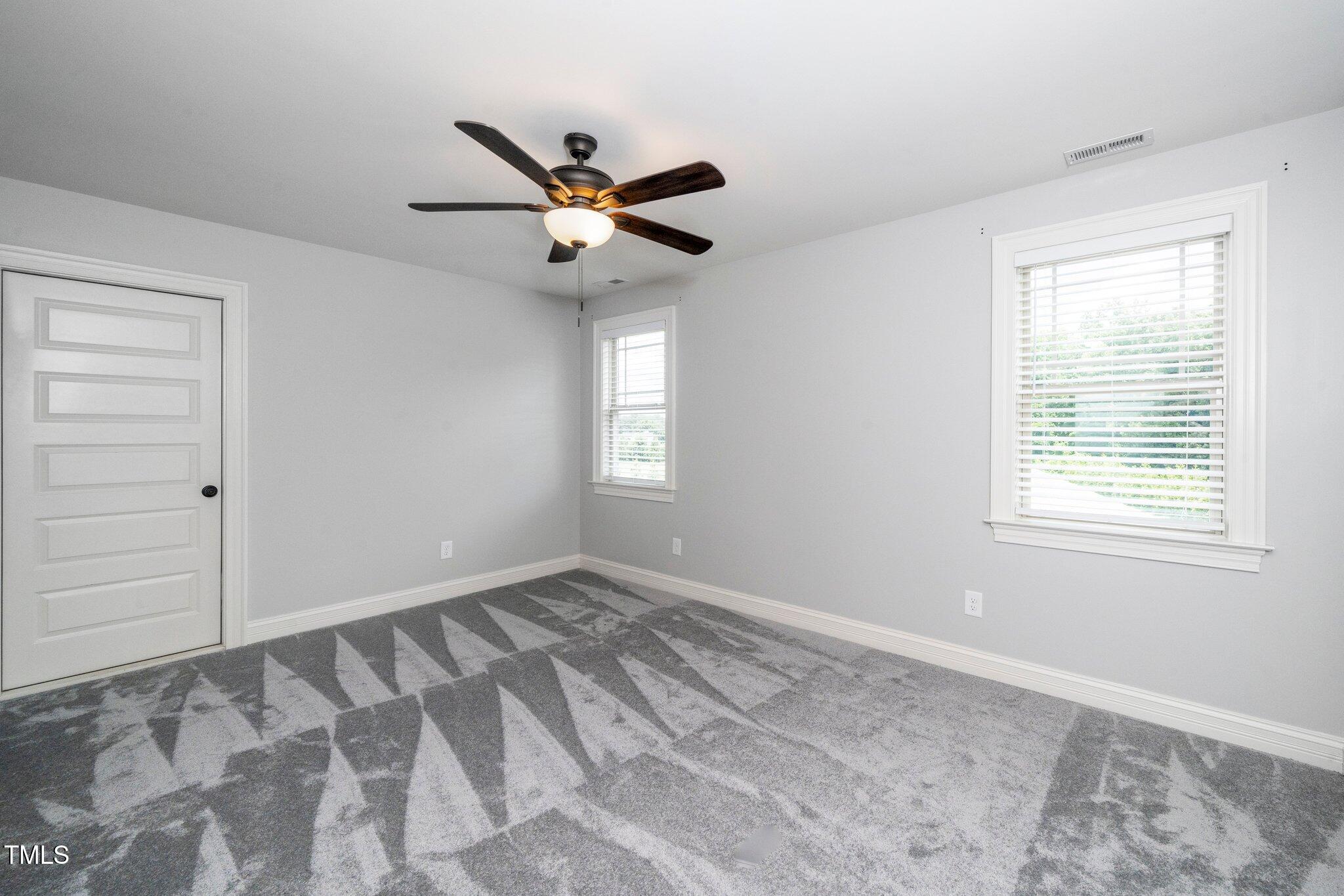 6737 Dwight Rowland Road Willow Spring, NC 27592 - Photo 32 of 50 a view of an empty room with a window