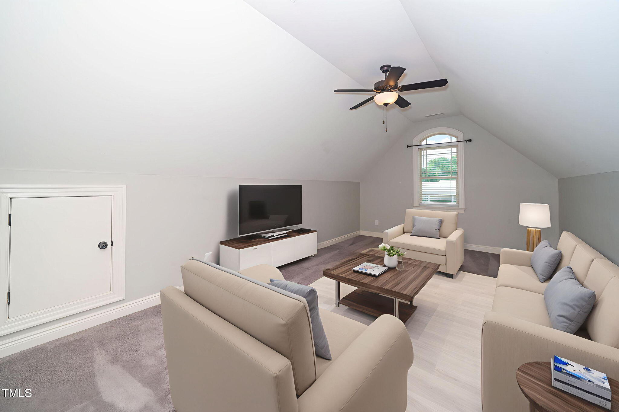 6737 Dwight Rowland Road Willow Spring, NC 27592 - Photo 36 of 50 a living room with furniture a ceiling fan and a window