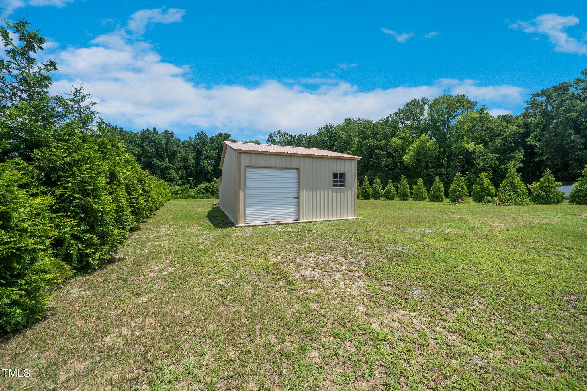 6737 Dwight Rowland Road Willow Spring, NC 27592 - Photo 46 of 50 a view of a backyard