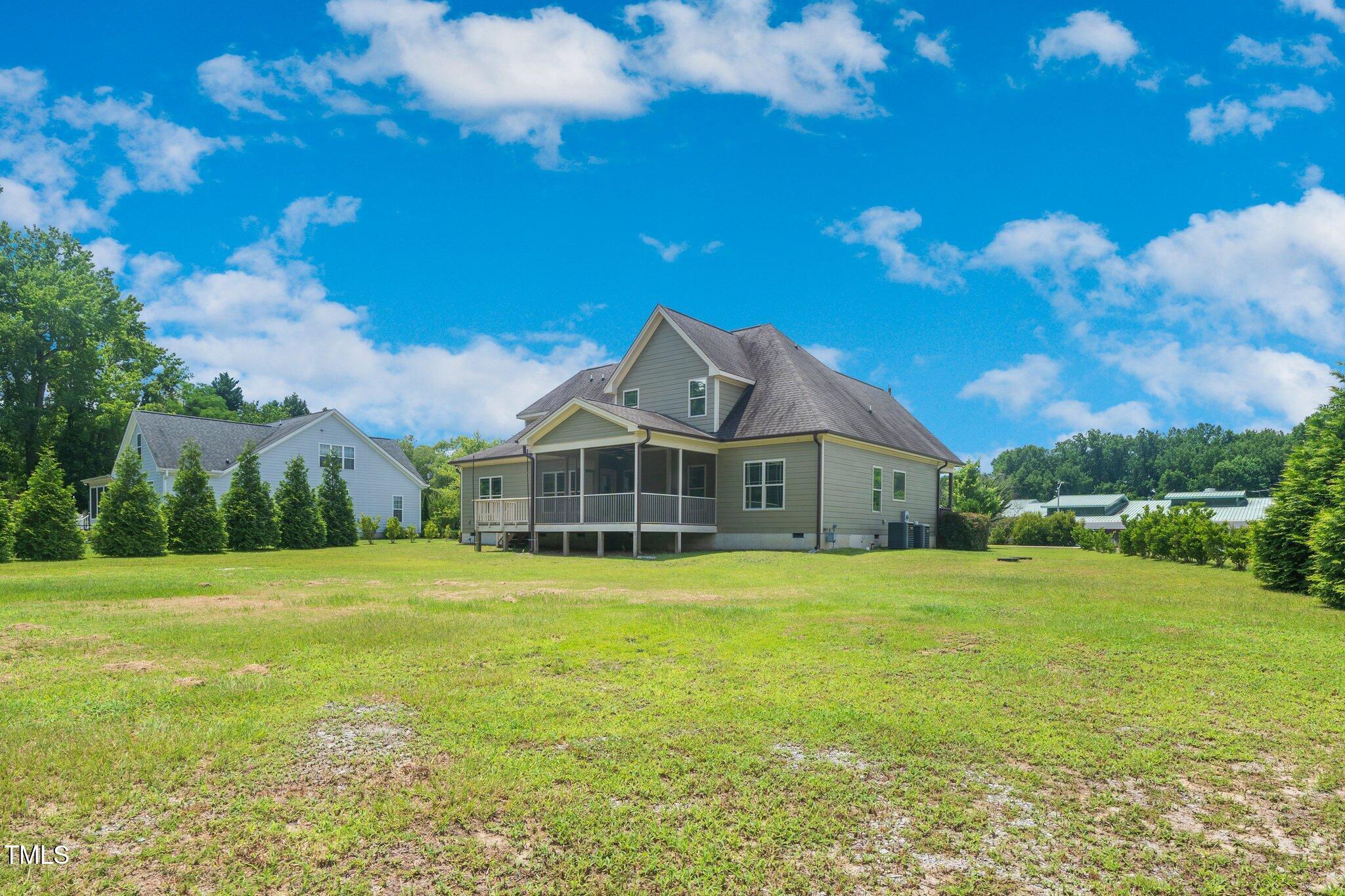 6737 Dwight Rowland Road Willow Spring, NC 27592 - Photo 47 of 50 a front view of a house with a big yard