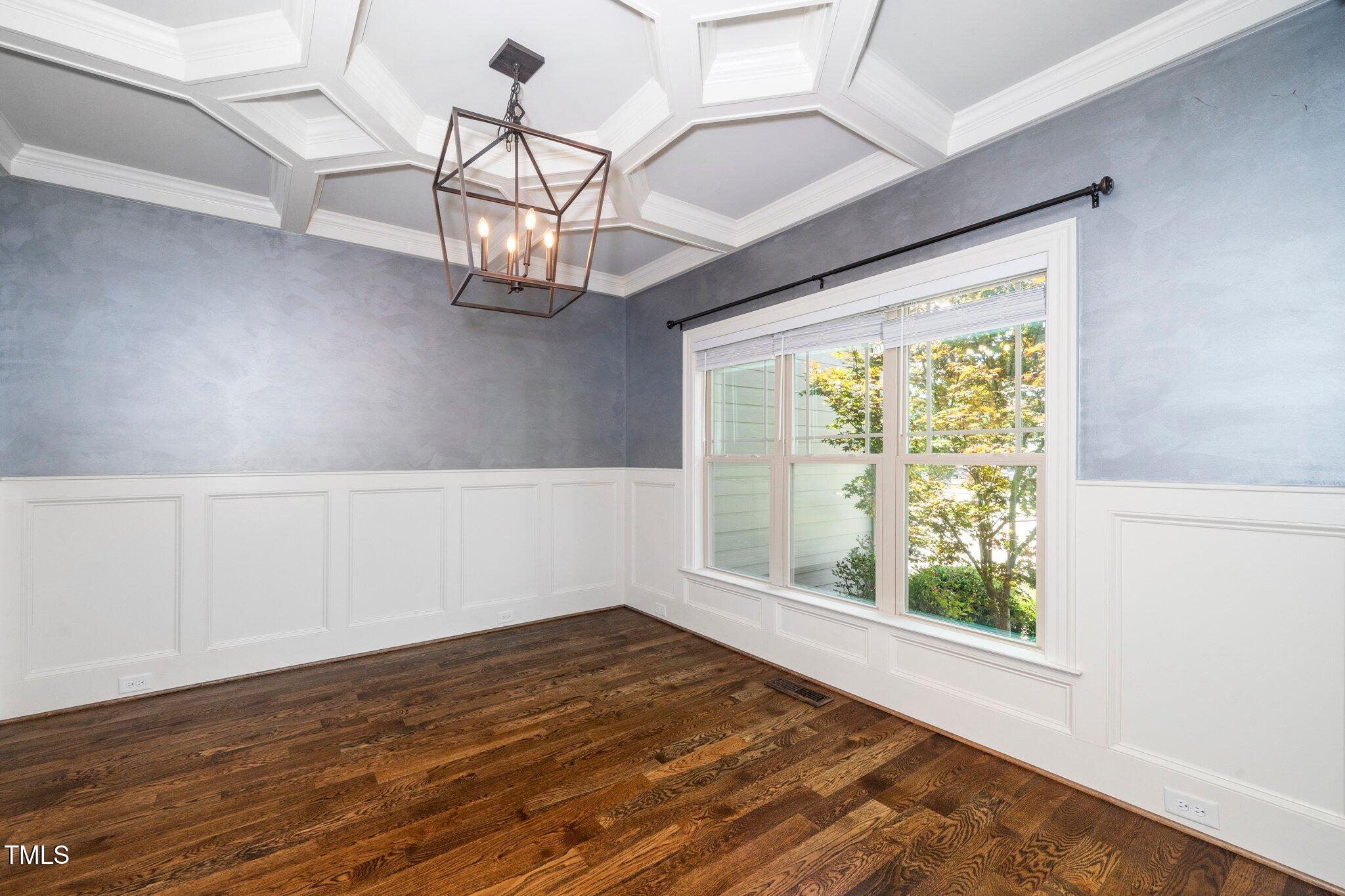 6737 Dwight Rowland Road Willow Spring, NC 27592 - Photo 8 of 50 a view of empty room with wooden floor and fan