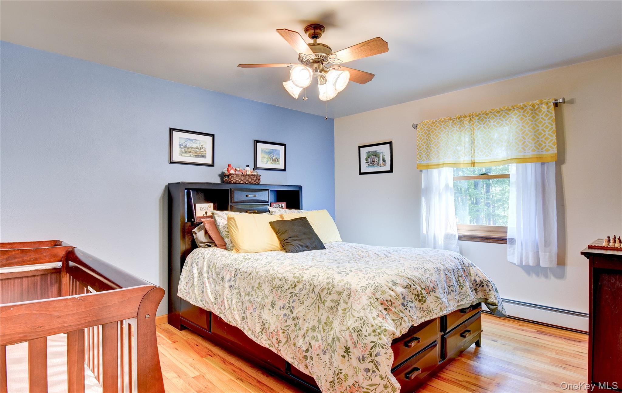 29 Valley View Road Bloomingburg, NY 12721 - Photo 17 of 50 a bedroom with a bed and a chandelier