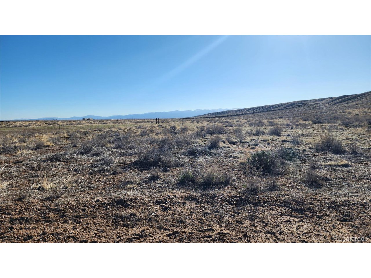 44 Collins Court Sanford, CO 81151 - Photo 13 of 15 a open area with a yard