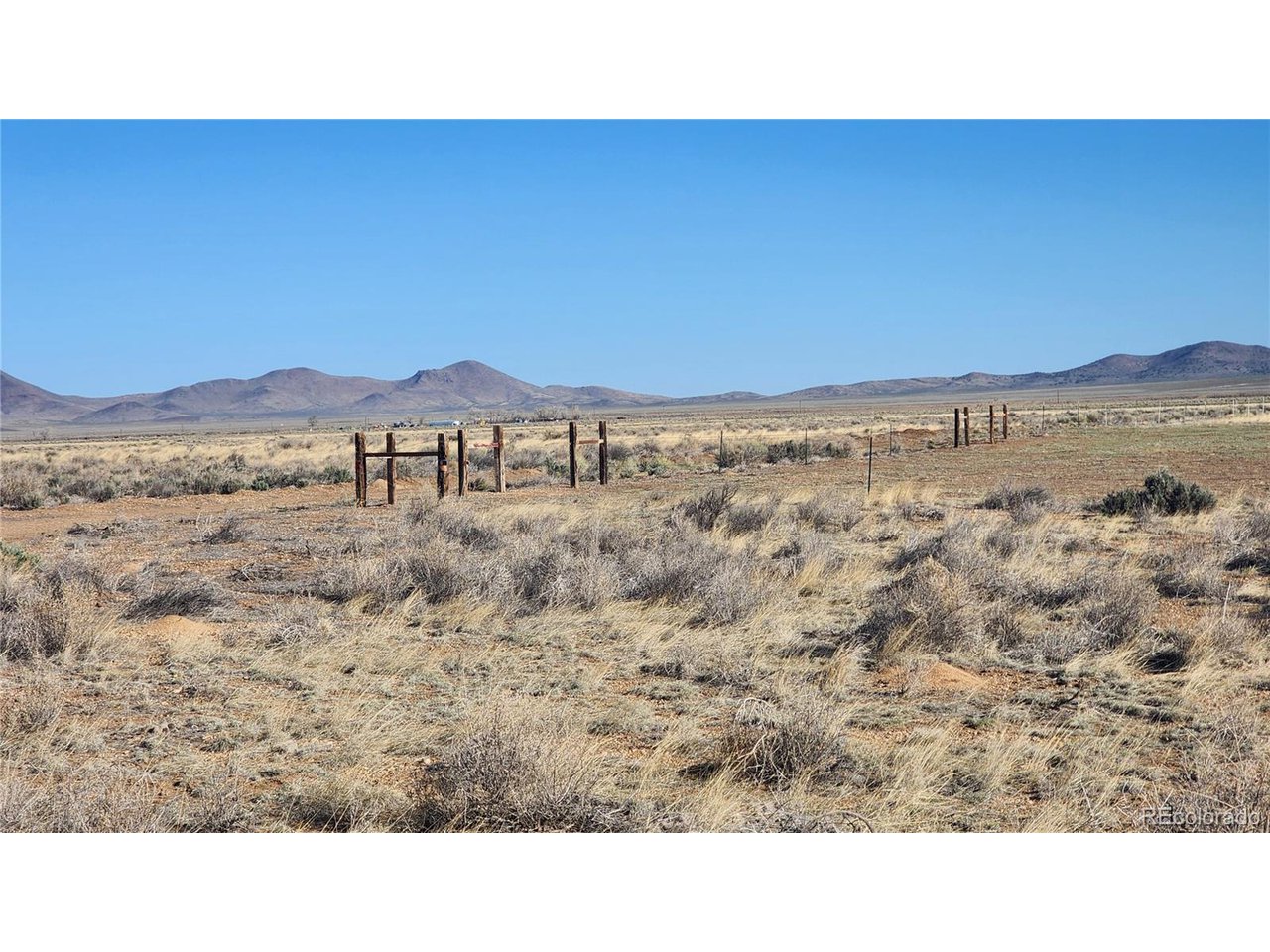 44 Collins Court Sanford, CO 81151 - Photo 3 of 15 a black and white photo of a house