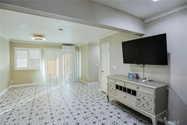 a room with furniture and flat screen tv