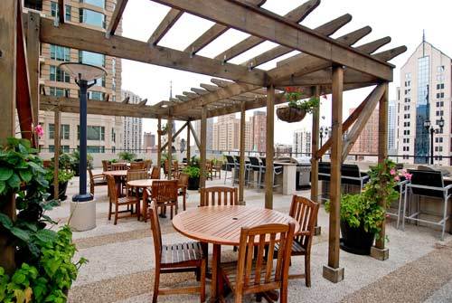30 East Huron Street, Unit 3901 Chicago, IL 60611 - Photo 13 of 13 a outdoor dining space with furniture and garden view