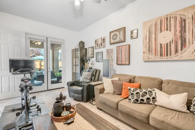 a bedroom with a bed and a book shelf