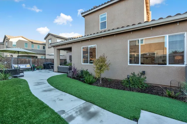 a outdoor dining space with furniture and outdoor view