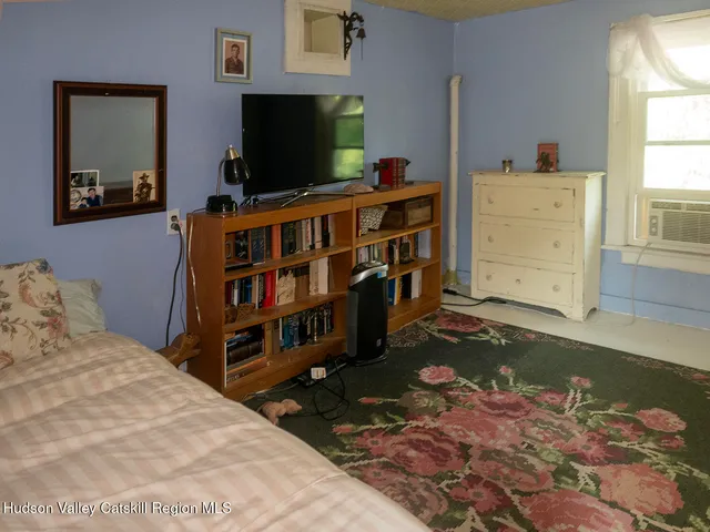 a room with furniture and flat screen tv