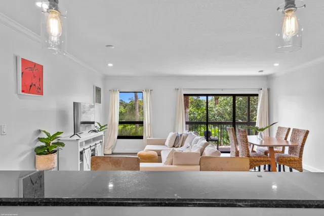 a view of a dining room with furniture window and outside view