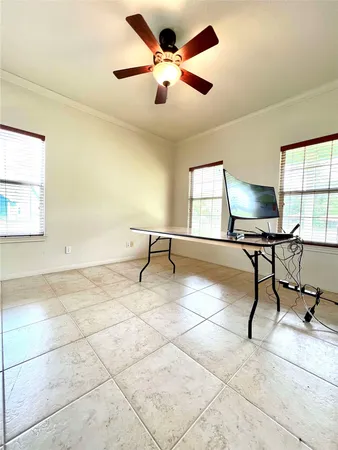 a work room with furniture and a window