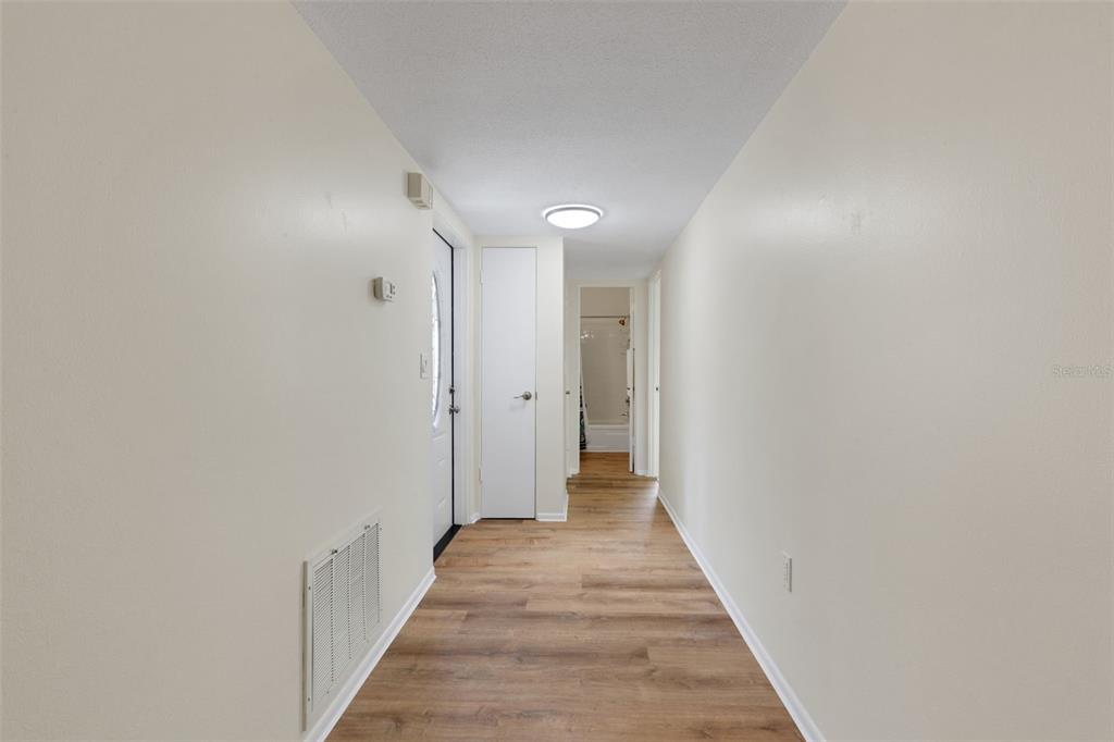 66 Strathmore Boulevard Sarasota, FL 34233 - Photo 14 of 39 a view of a hallway with wooden floor