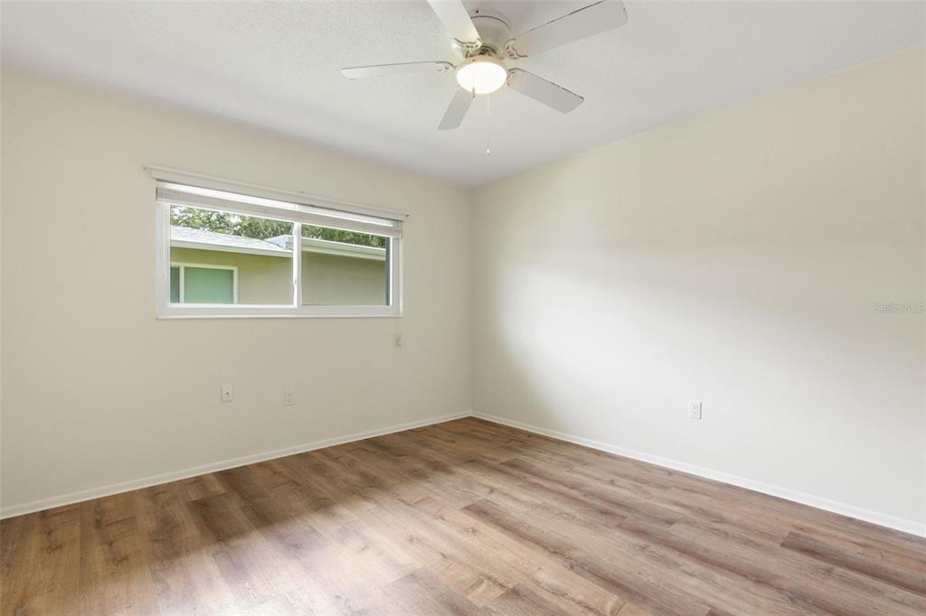66 Strathmore Boulevard Sarasota, FL 34233 - Photo 17 of 39 an empty room with a window and a fan