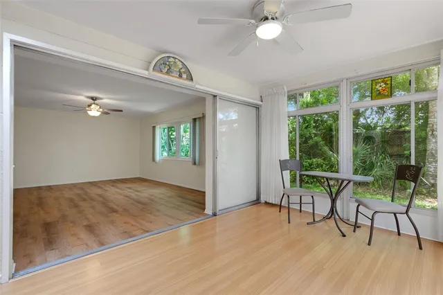 a view of a livingroom with furniture and a window
