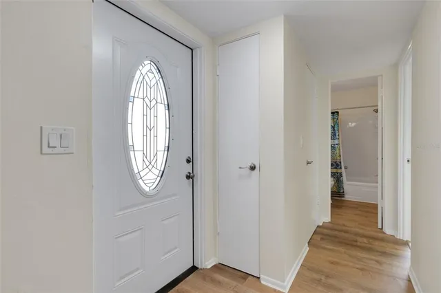 a view of front door with wooden floor