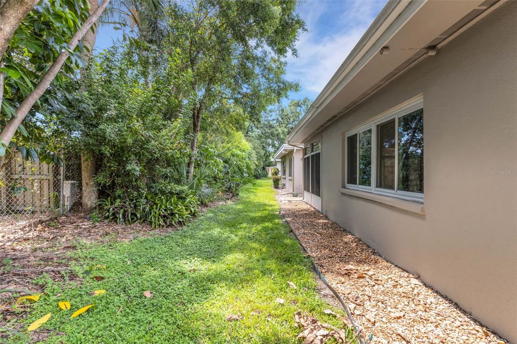 66 Strathmore Boulevard Sarasota, FL 34233 - Photo 34 of 39 a view of a house with a yard