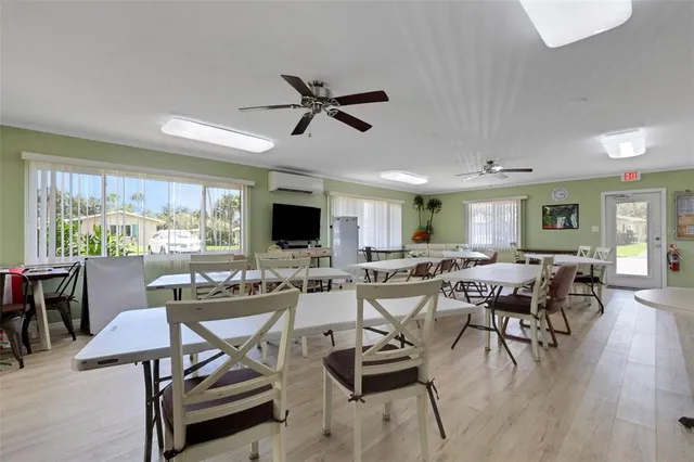 a living room with lots of furniture and a flat screen tv