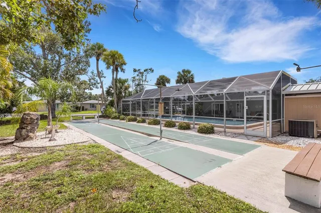 a view of a swimming pool with sitting area