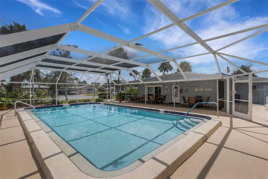 66 Strathmore Boulevard Sarasota, FL 34233 - Photo 4 of 39 a view of a swimming pool with a patio