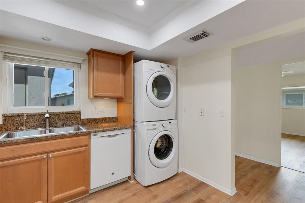 66 Strathmore Boulevard Sarasota, FL 34233 - Photo 5 of 39 a utility room with sink dryer and washer