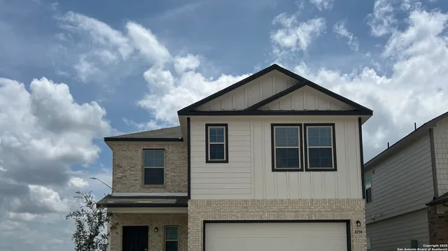 a front view of a house with yard