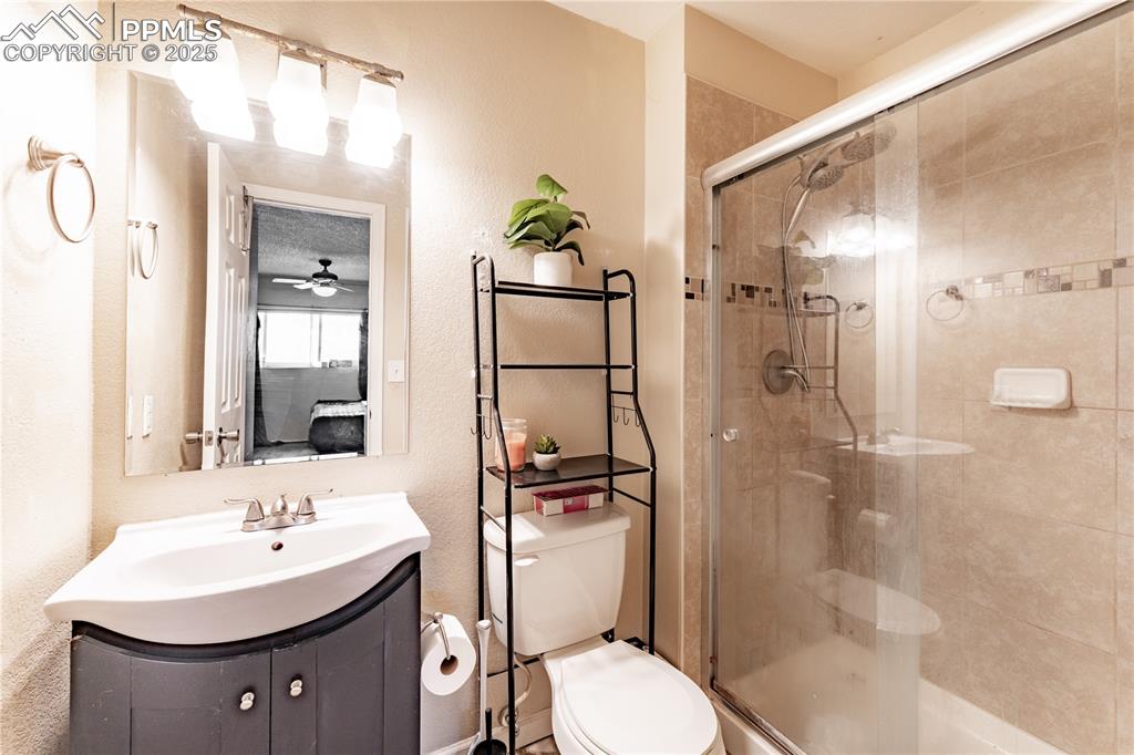 538 Blossom Field Road Fountain, CO 80817 - Photo 4 of 16 a bathroom with a sink toilet and shower