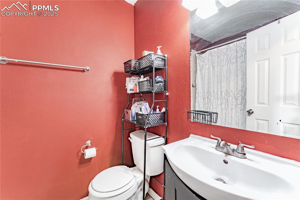 538 Blossom Field Road Fountain, CO 80817 - Photo 6 of 16 a bathroom with a sink a toilet and shower