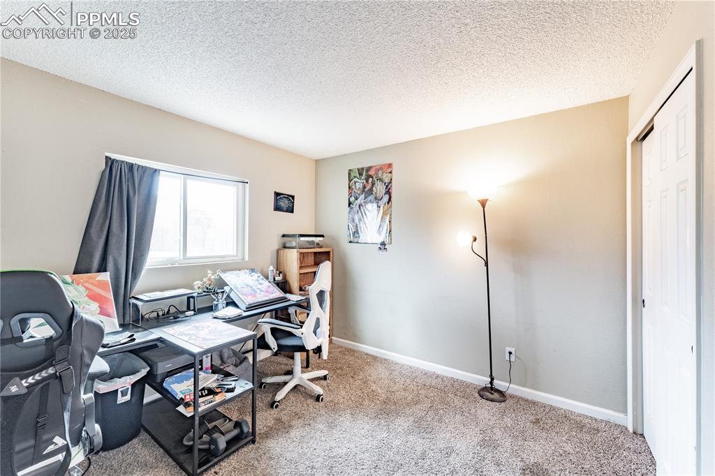538 Blossom Field Road Fountain, CO 80817 - Photo 7 of 16 a workspace with furniture and a window