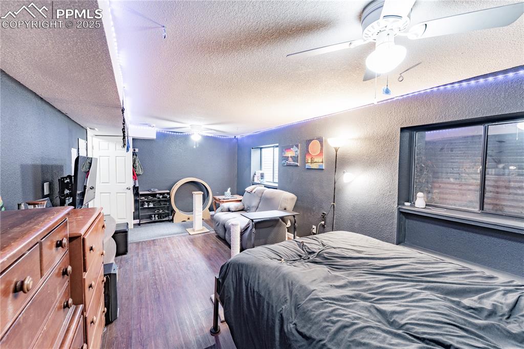 538 Blossom Field Road Fountain, CO 80817 - Photo 9 of 16 a bedroom with two beds and a dresser