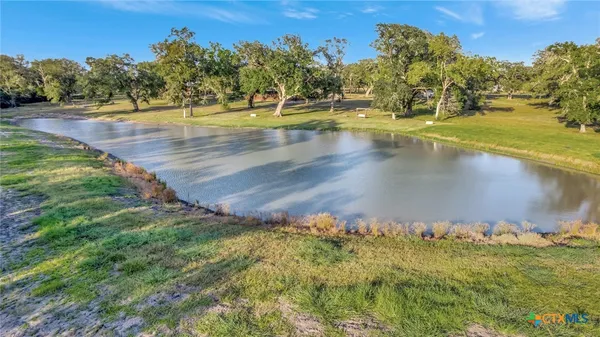 a view of lake with green space