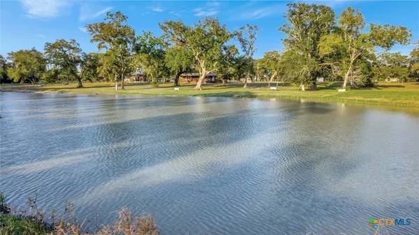 a view of outdoor space with deck and trees