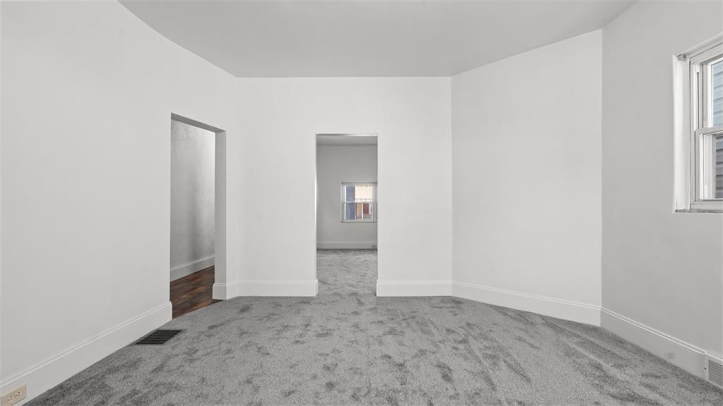 210 19th Street Pittsburgh, PA 15215 - Photo 17 of 33 an empty room with windows and entrance