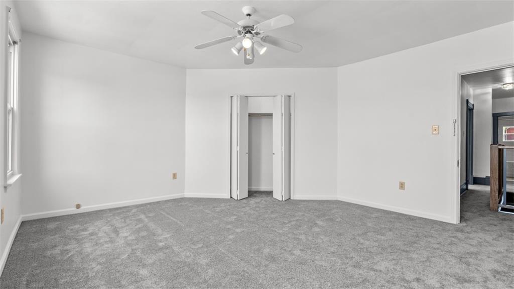 210 19th Street Pittsburgh, PA 15215 - Photo 18 of 33 a view of an empty room with a ceiling fan