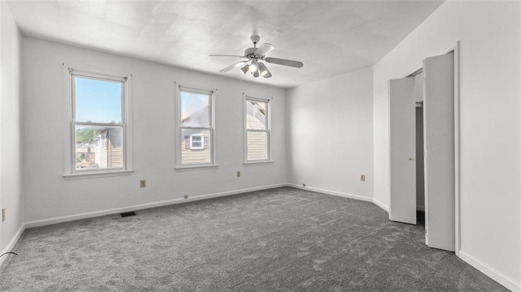 210 19th Street Pittsburgh, PA 15215 - Photo 19 of 33 a view of an empty room with chandelier fan