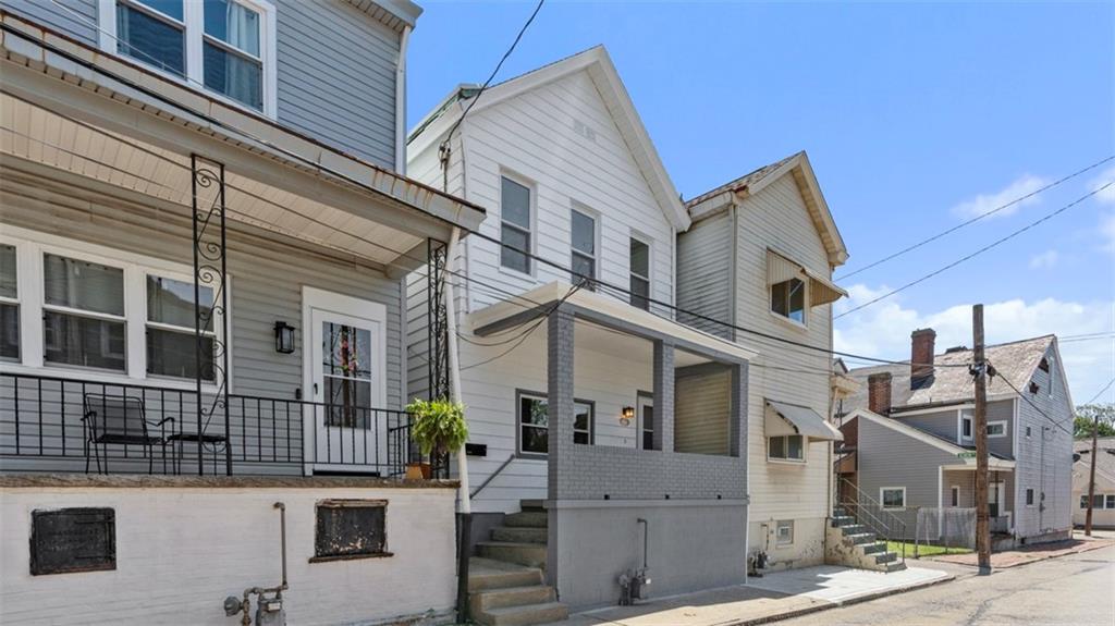 210 19th Street Pittsburgh, PA 15215 - Photo 2 of 33 a view of a white building among the street
