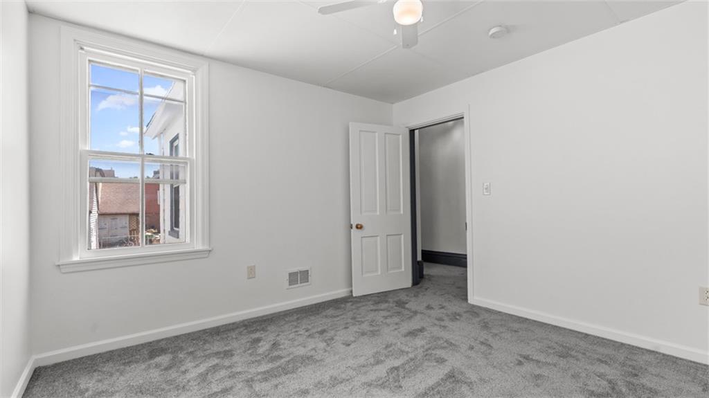 210 19th Street Pittsburgh, PA 15215 - Photo 25 of 33 an empty room with windows