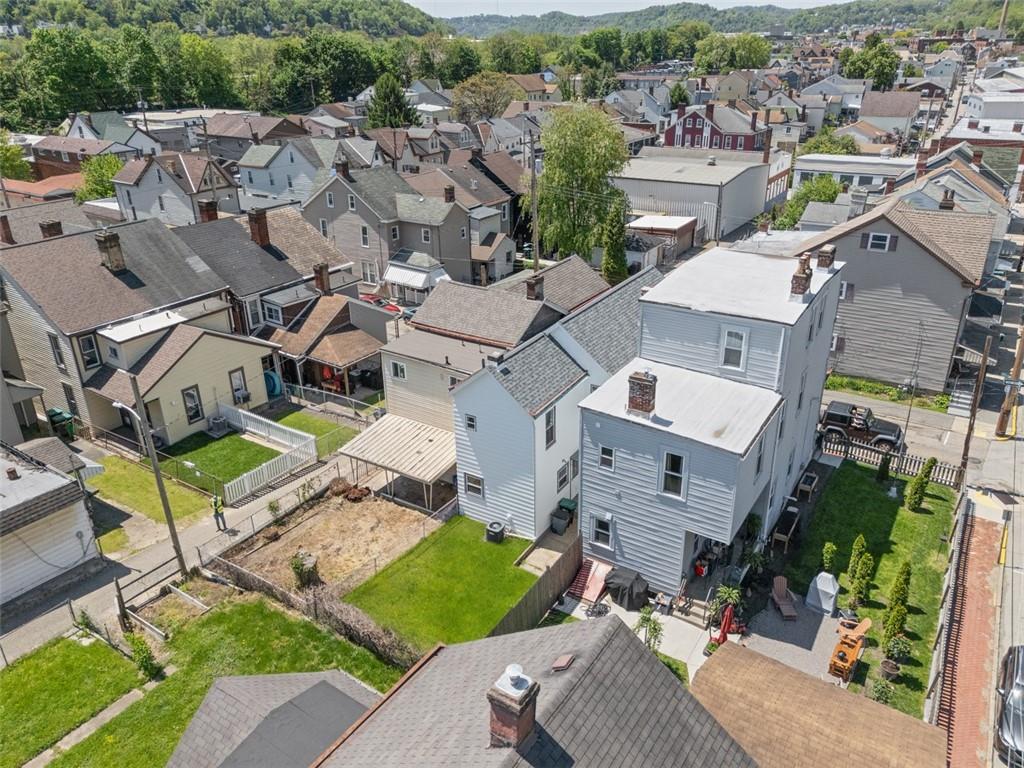210 19th Street Pittsburgh, PA 15215 - Photo 29 of 33 an aerial view of a house with a yard and lake view