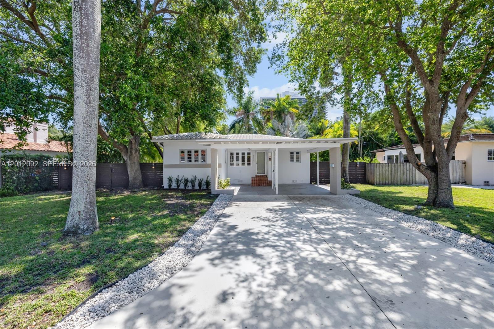 830 Northeast 72nd Street Miami, FL 33138 - Photo 1 of 19 a view of house with a yard