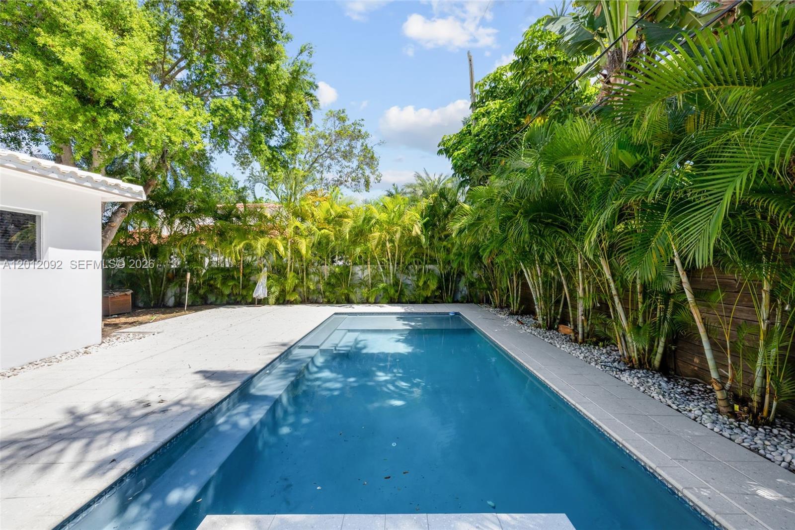 830 Northeast 72nd Street Miami, FL 33138 - Photo 15 of 19 a view of a backyard of the house