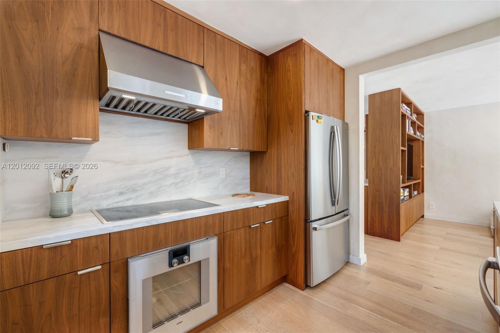 830 Northeast 72nd Street Miami, FL 33138 - Photo 8 of 19 a kitchen with stainless steel appliances cabinets and a counter top space