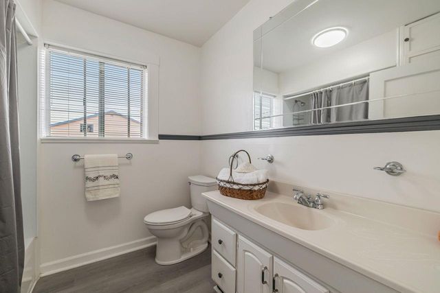 a kitchen with sink cabinets and window