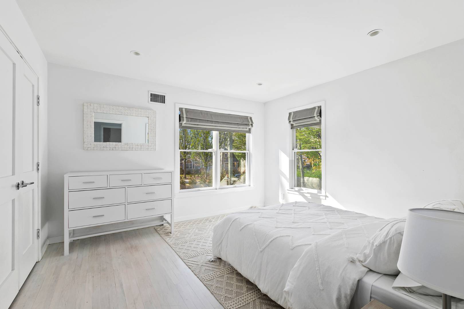 47 Tansey Lane Bridgehampton, NY 11932 - Photo 17 of 28 a spacious bedroom with a bed and a window