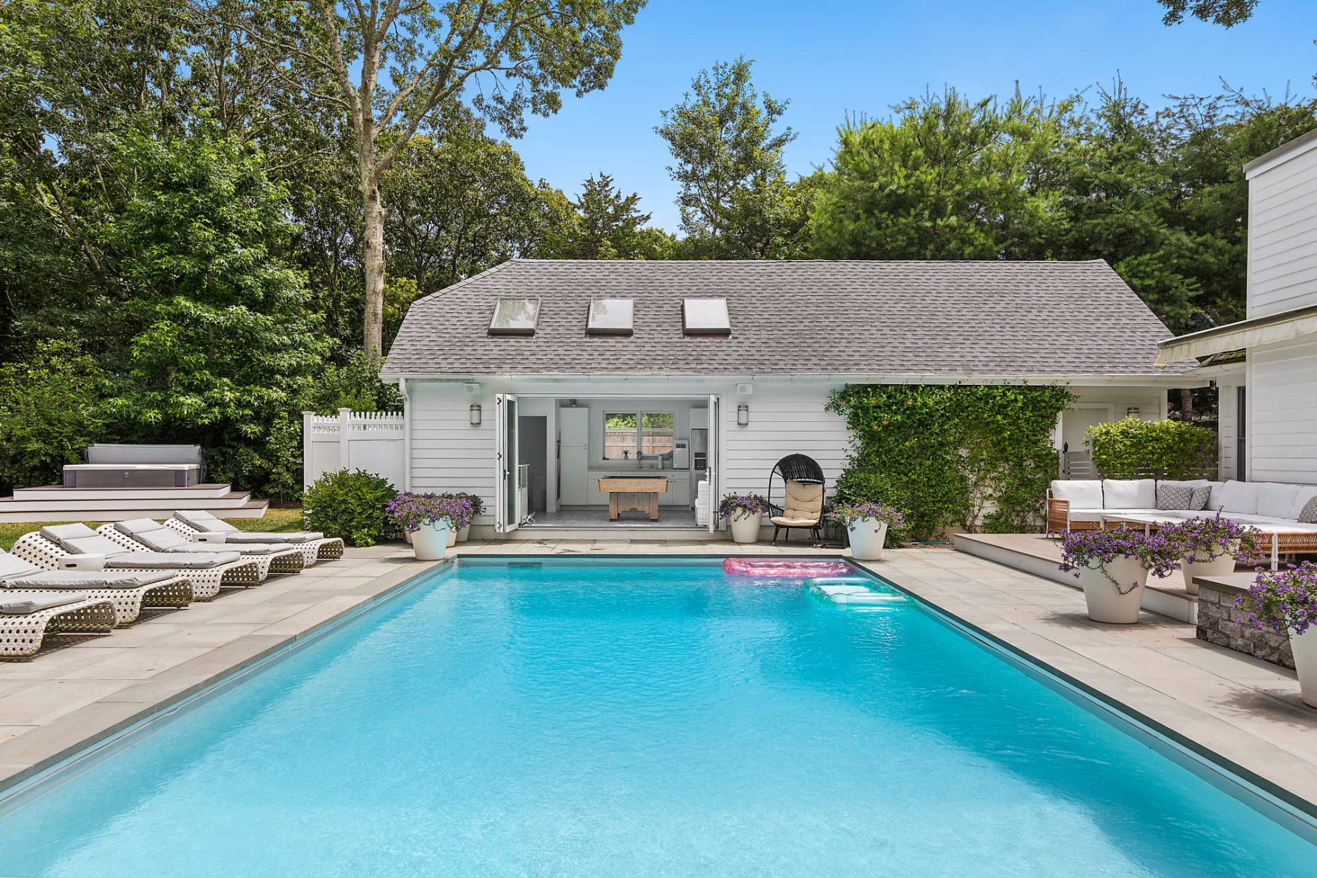 47 Tansey Lane Bridgehampton, NY 11932 - Photo 2 of 28 a front view of a house with garden