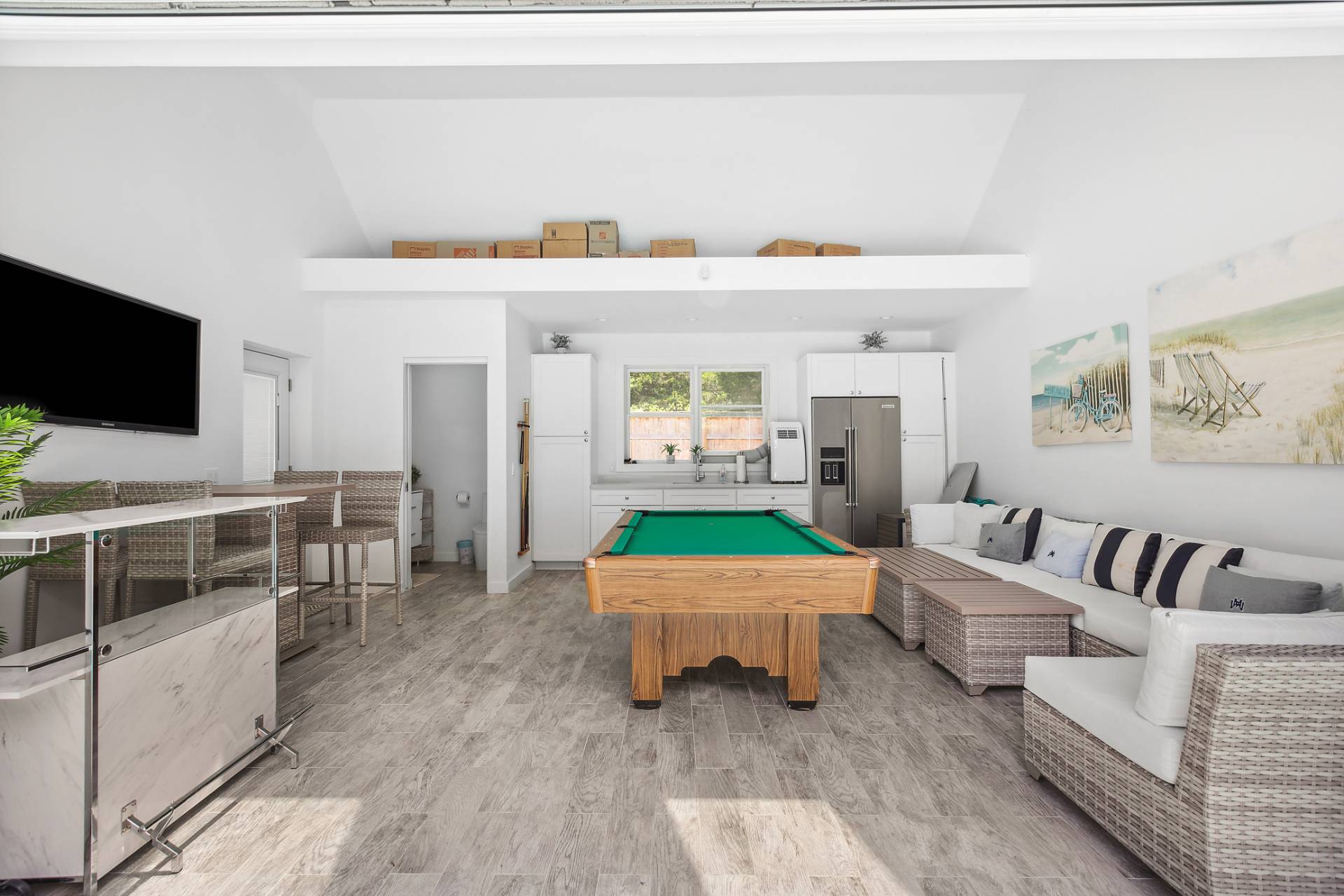 47 Tansey Lane Bridgehampton, NY 11932 - Photo 26 of 28 a living room with furniture and a flat screen tv